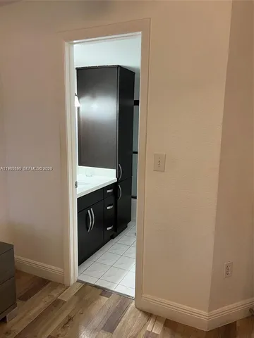 a bathroom with a double vanity sink and mirror
