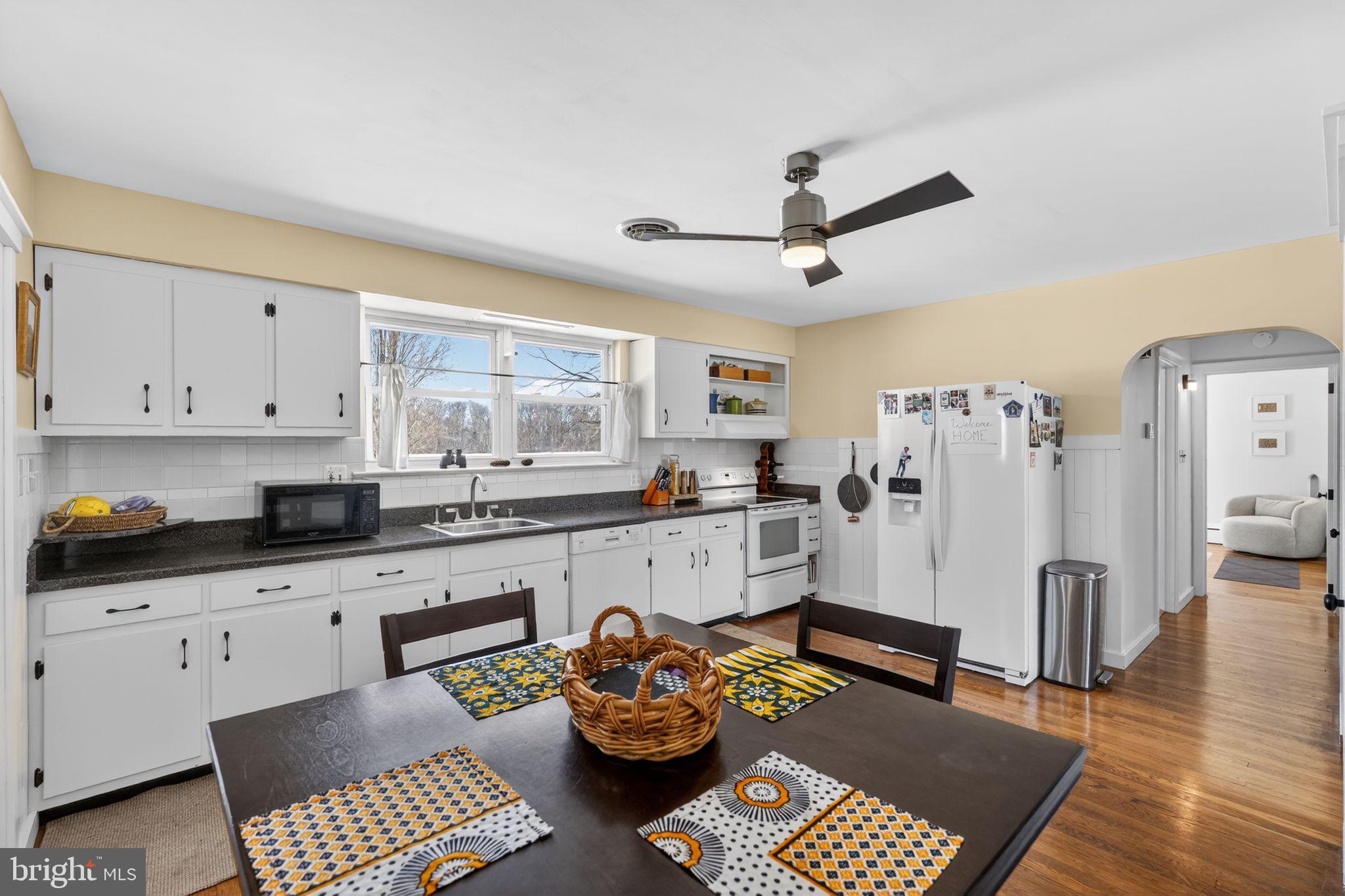 110 Landing Street Southampton, NJ 08088 - Photo 15 of 30 a kitchen with stainless steel appliances kitchen island granite countertop a refrigerator and cabinets