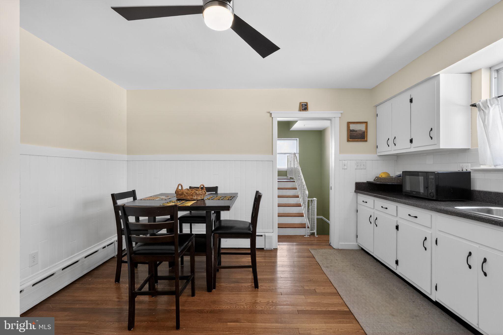 110 Landing Street Southampton, NJ 08088 - Photo 16 of 30 a kitchen with granite countertop white cabinets and stainless steel appliances