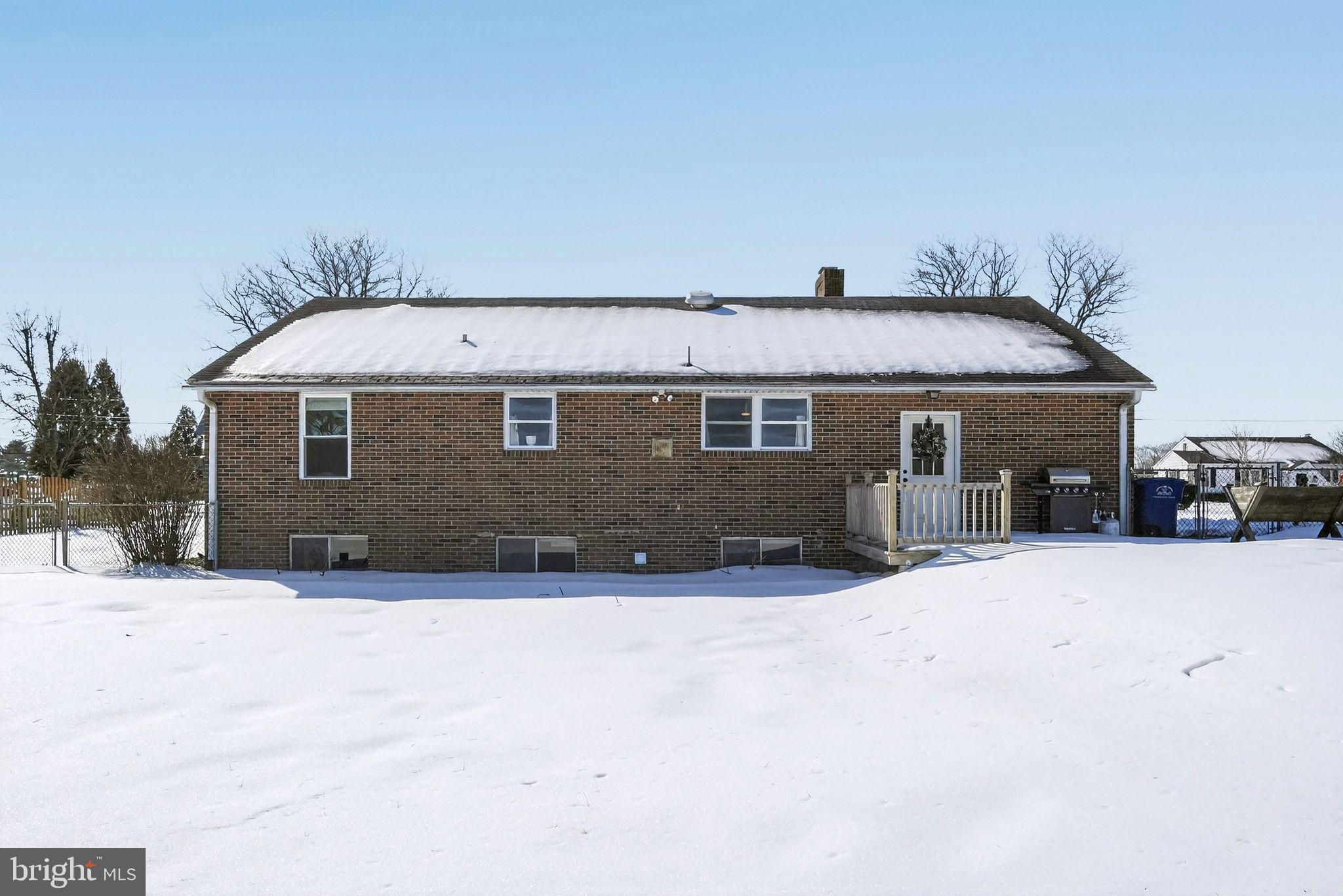 110 Landing Street Southampton, NJ 08088 - Photo 5 of 30 a front view of a house with a yard covered in snow