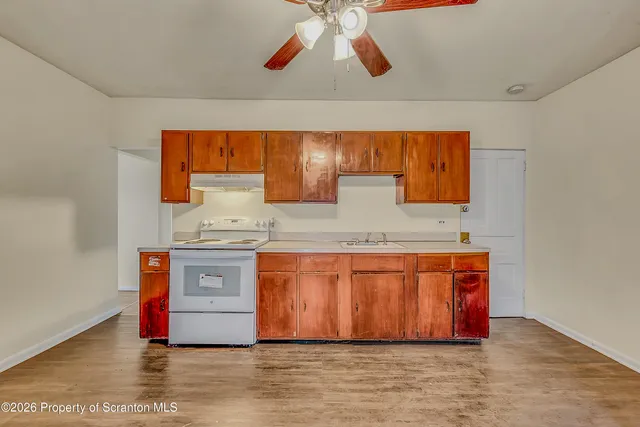 a spacious bathroom with stainless steel appliances granite countertop a sink and a granite counter tops