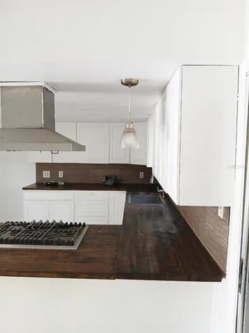 a kitchen with a stove and a refrigerator
