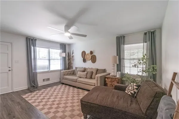 a living room with furniture and a window