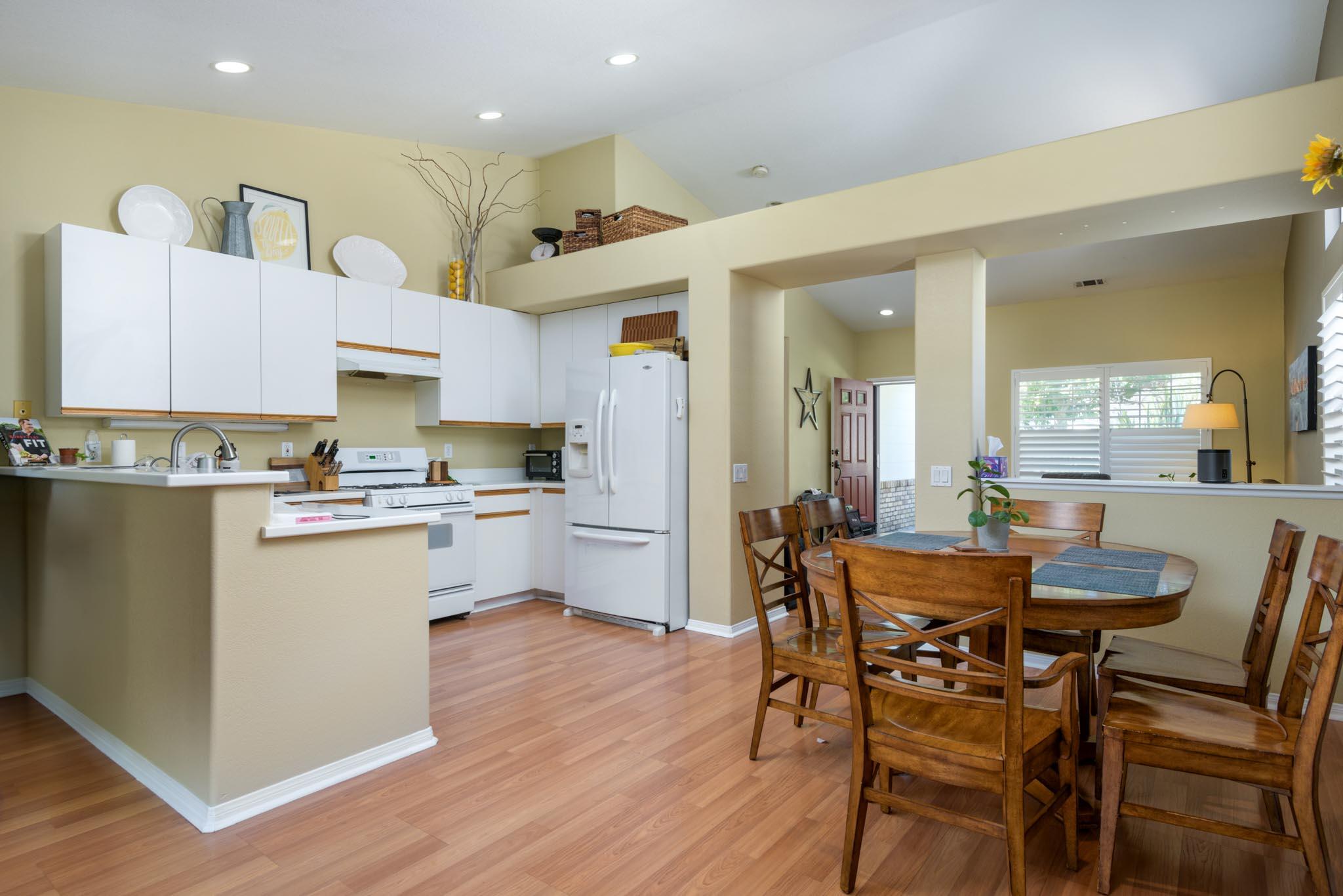 128 Gerard Drive Goleta, CA 93117 - Photo 1 of 20 a kitchen with a table and chairs in it