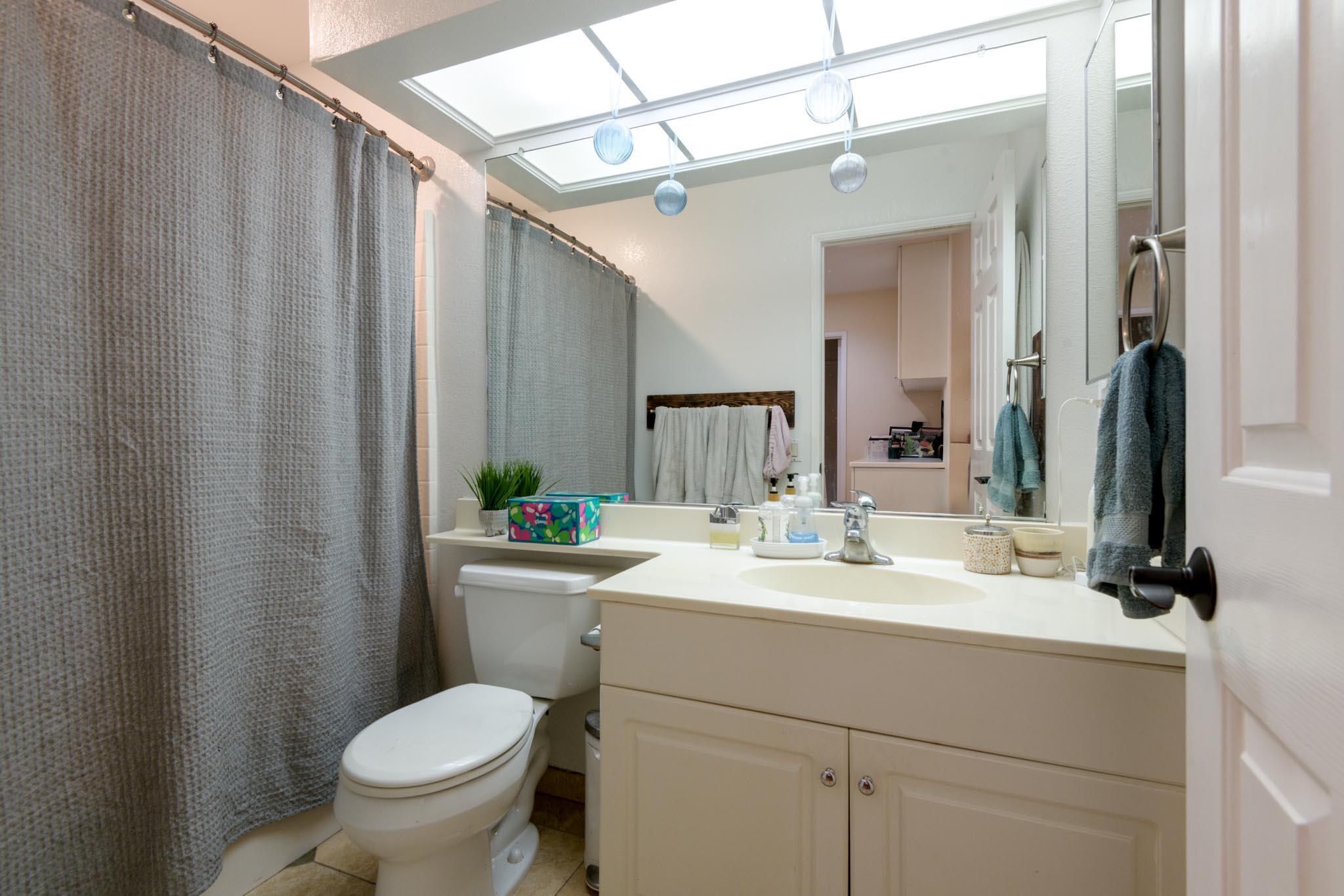 128 Gerard Drive Goleta, CA 93117 - Photo 11 of 20 a bathroom with a sink toilet and shower