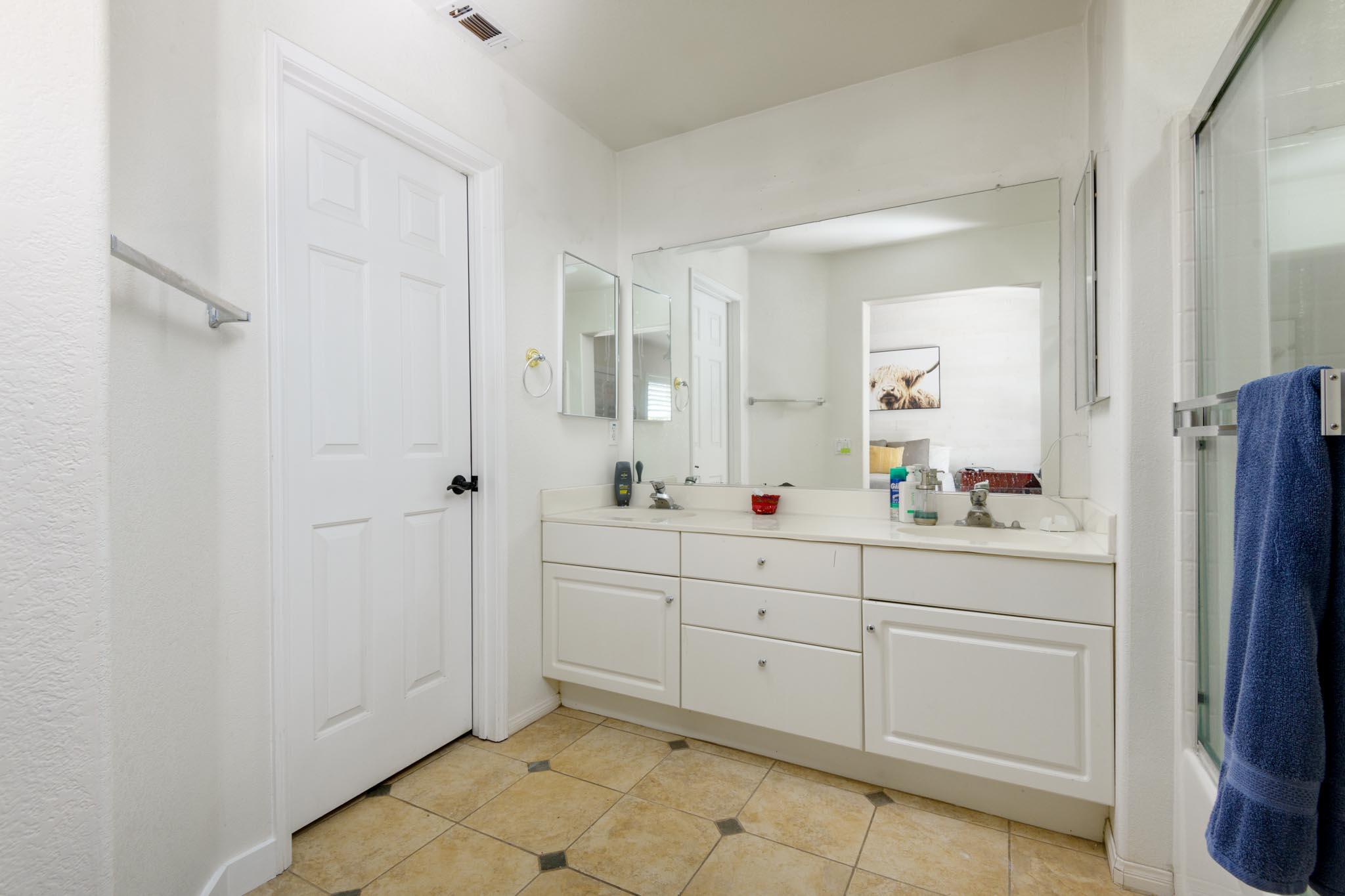 128 Gerard Drive Goleta, CA 93117 - Photo 12 of 20 a bathroom with a sink and mirror