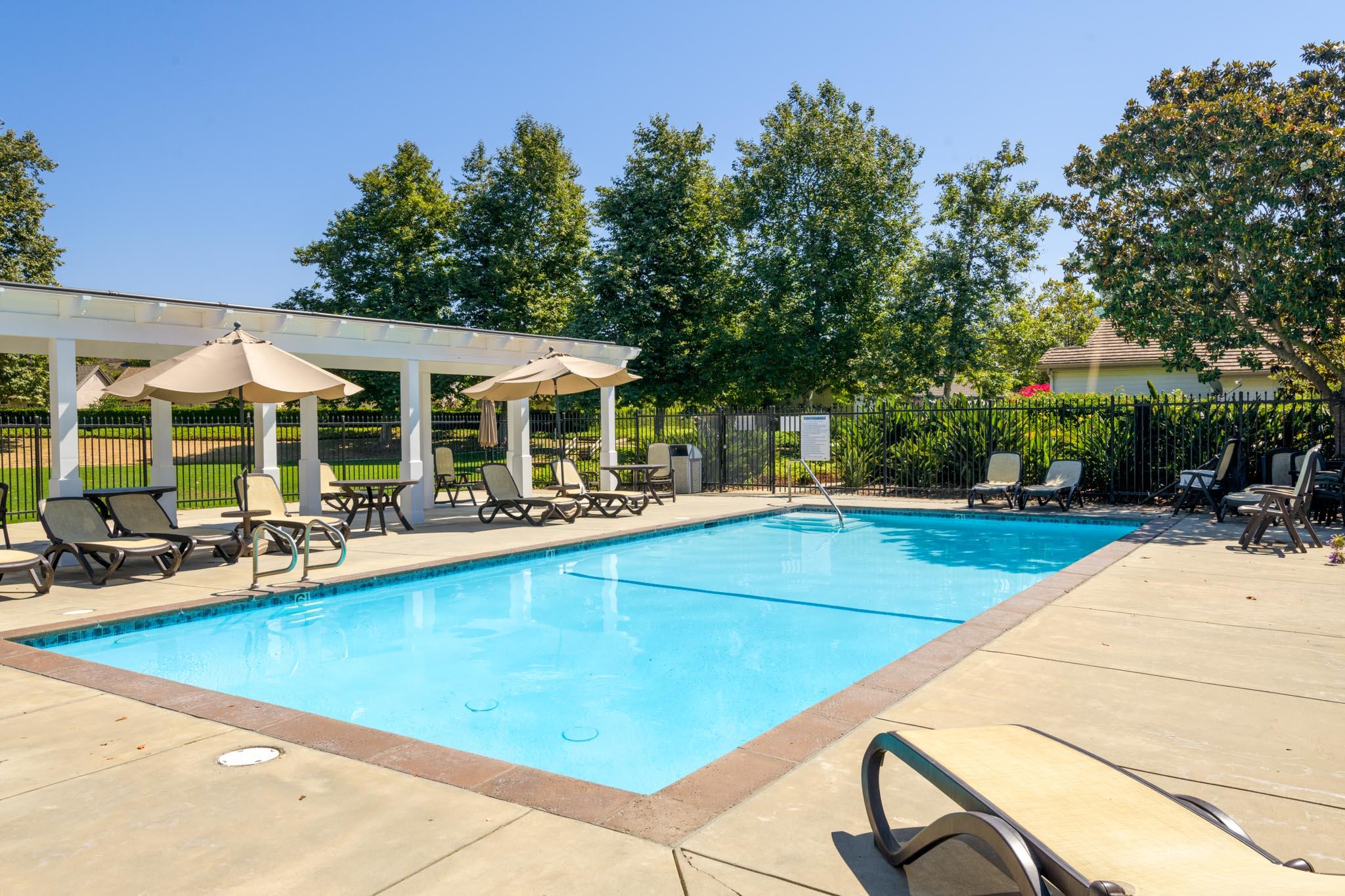 128 Gerard Drive Goleta, CA 93117 - Photo 17 of 20 a view of a house with pool and chairs