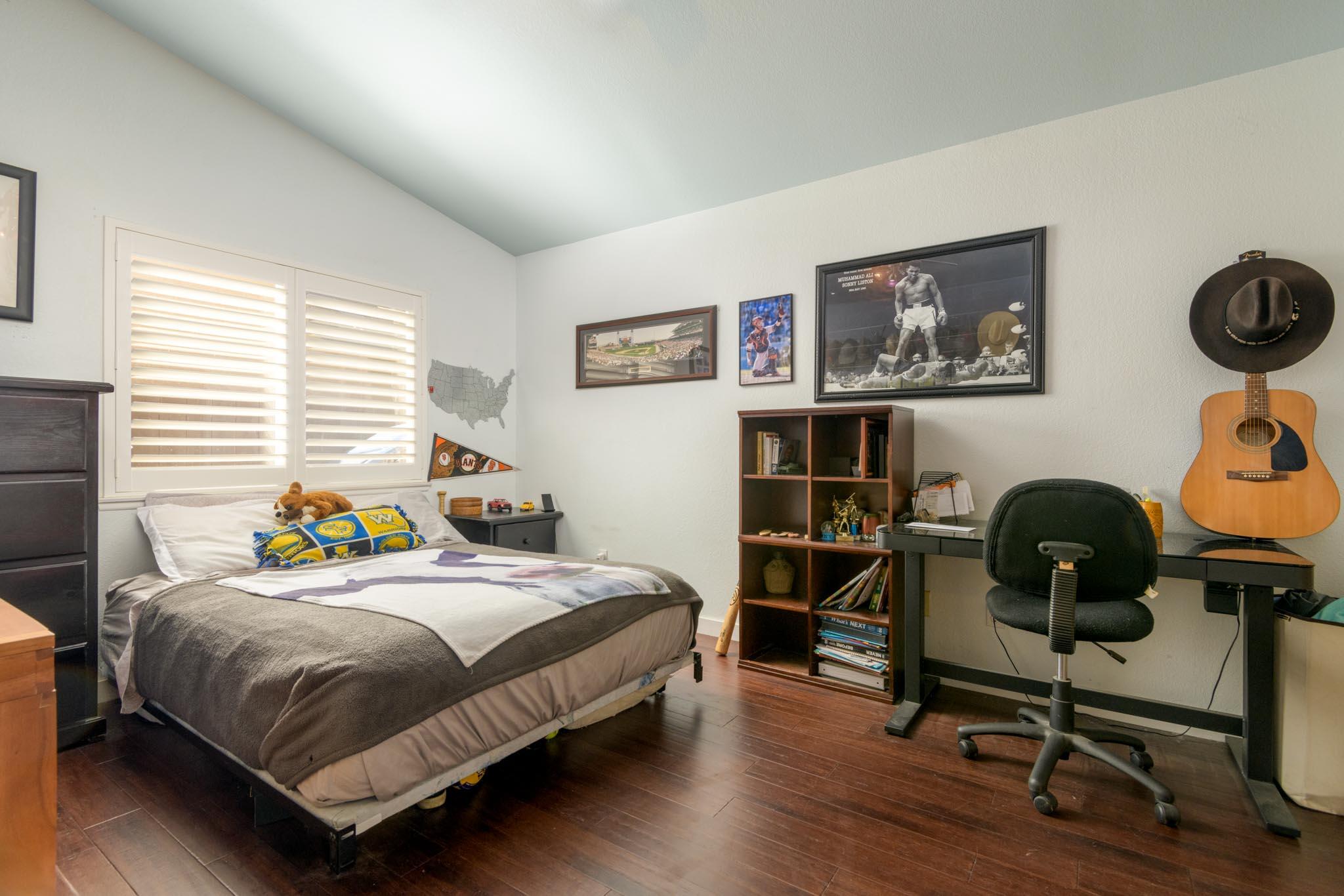 128 Gerard Drive Goleta, CA 93117 - Photo 9 of 20 a bedroom with a bed and a desk