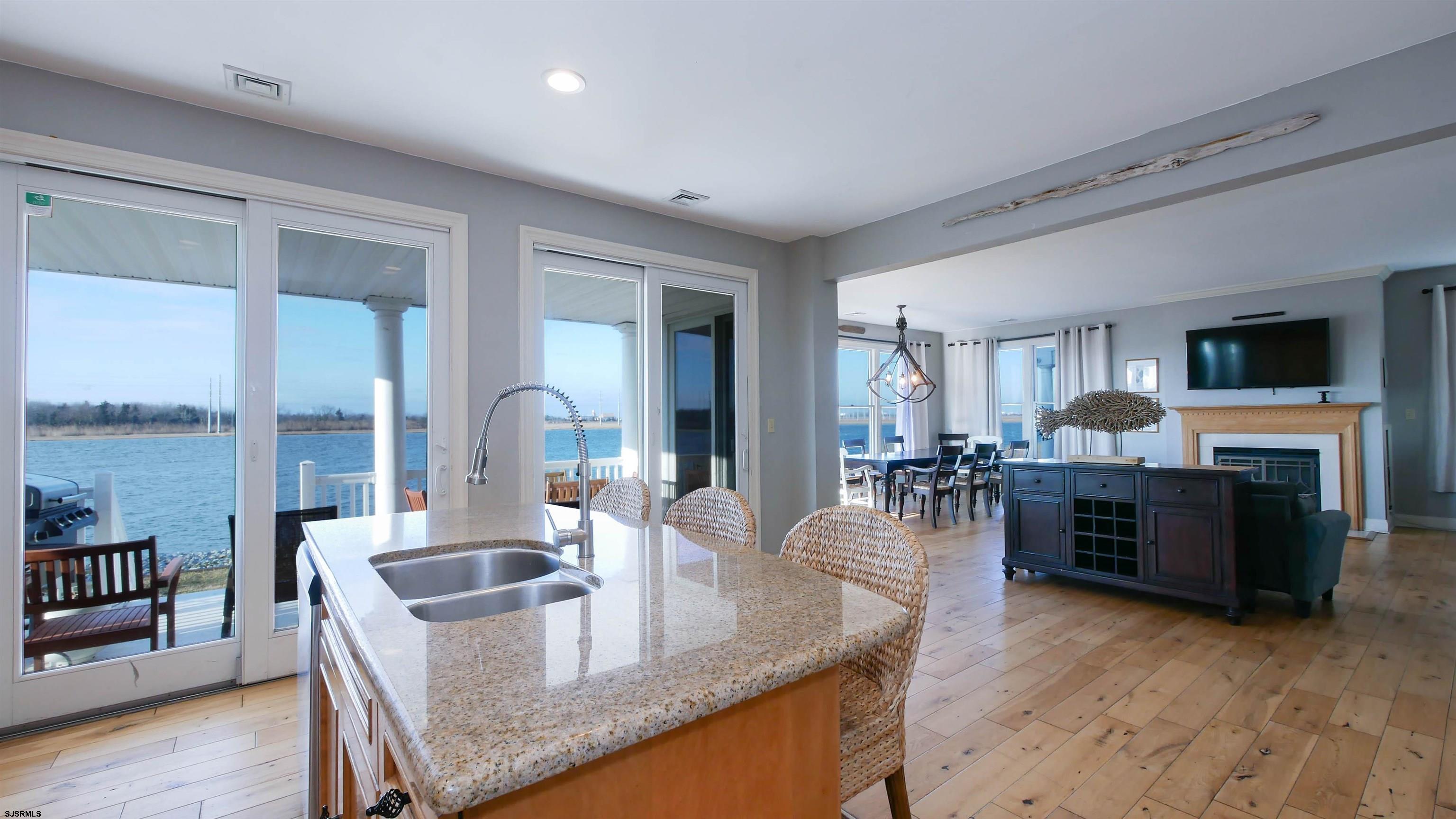 2070 West Riverside Drive Atlantic City, NJ 08401 - Photo 11 of 40 a kitchen with sink refrigerator and mountain view