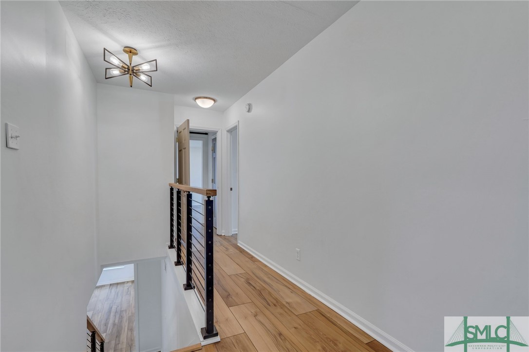 1015 Mill Hill Road Richmond Hill, GA 31324 - Photo 24 of 50 Upstairs Hallway - there is a door at end of hallw