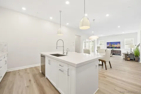 a kitchen with a table and chairs
