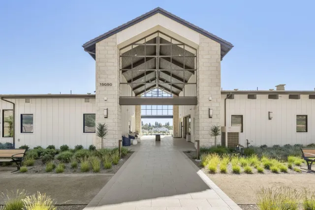 a view of a house with a small yard