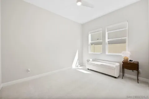 a spacious bedroom with a bed and a window
