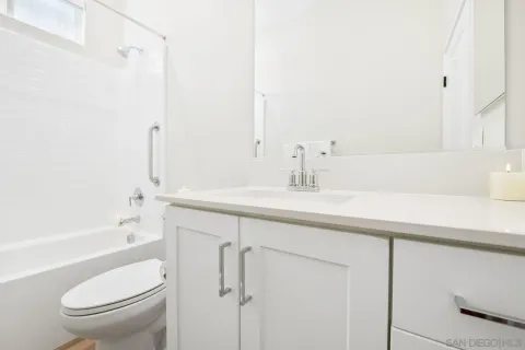 a bathroom with a sink a toilet and a bathtub