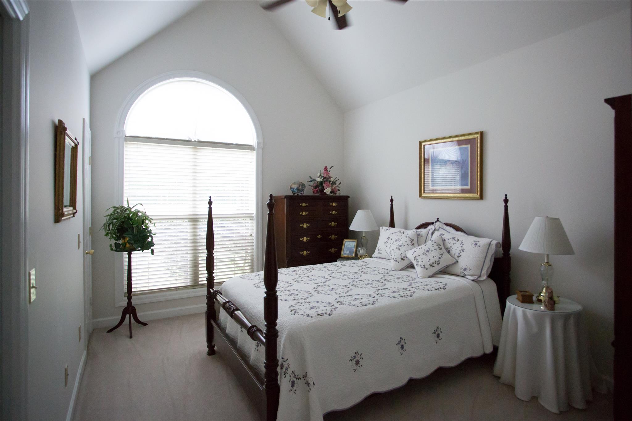 195 Vesta Road Lebanon, TN 37090 - Photo 14 of 19 a bedroom with a bed and a painting on the wall
