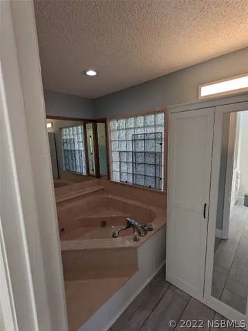 a bedroom with bed and window