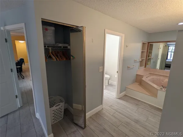a kitchen with granite countertop a sink stove and cabinets
