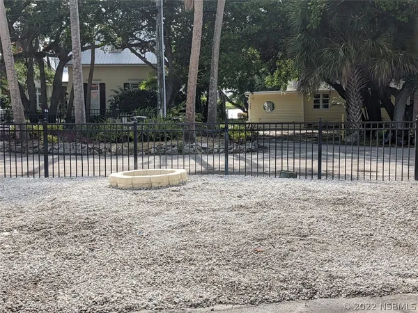 a view of a a dining room with furniture window and wooden floor