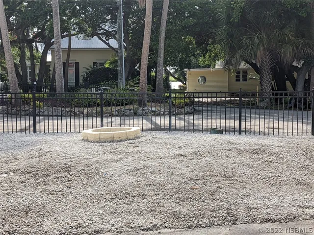 a view of a a dining room with furniture window and wooden floor