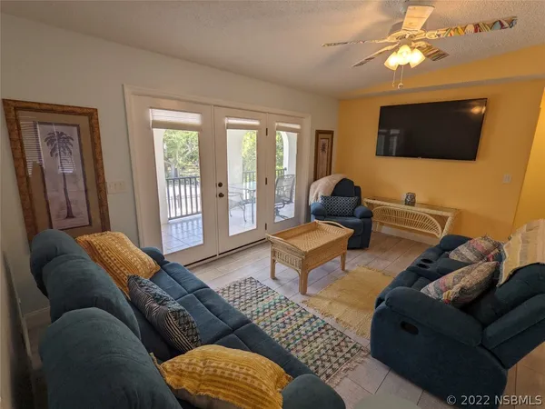 a view of balcony with wooden floor and fence