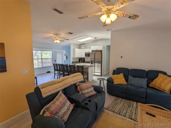 a view of balcony with furniture