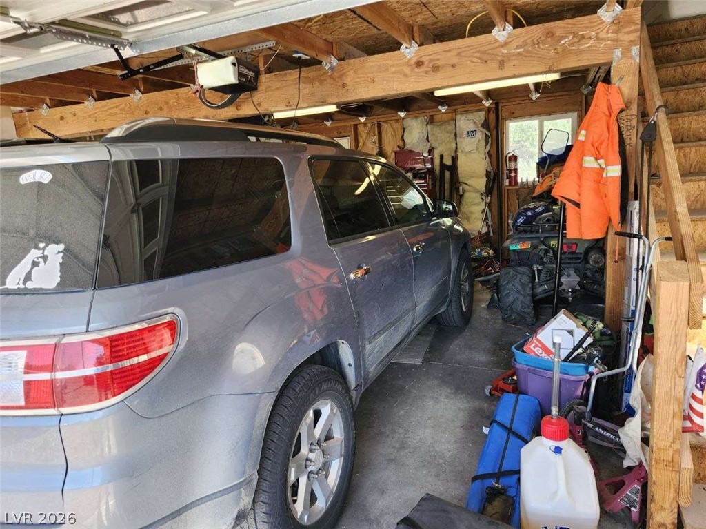 942 Holt Caliente, NV 89008 - Photo 7 of 22 Functional garage with ample space for vehicles and direct access to storage.
