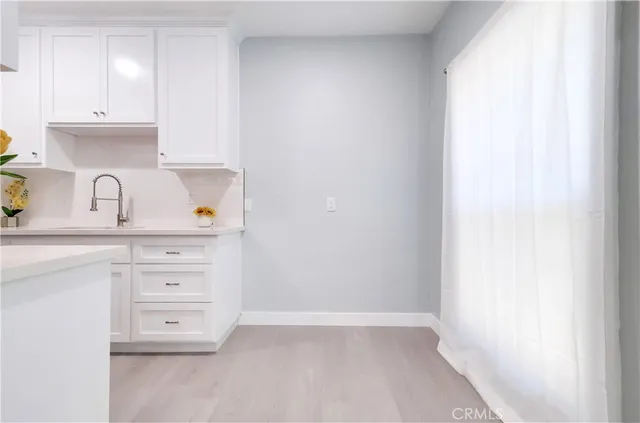 a view of cabinets and window