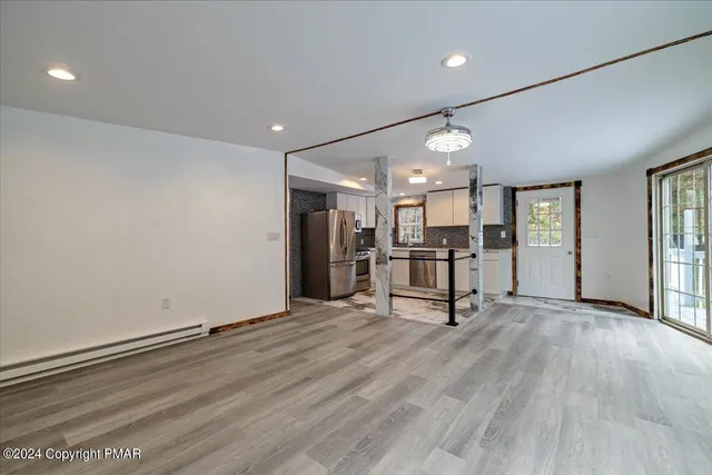a bathroom with a sink toilet and a mirror