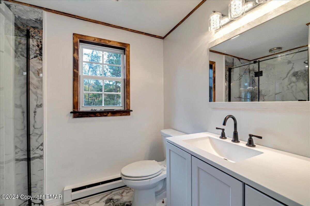 1456 Allegheny Drive Blakeslee, PA 18610 - Photo 21 of 94 a bathroom with a sink toilet and a mirror