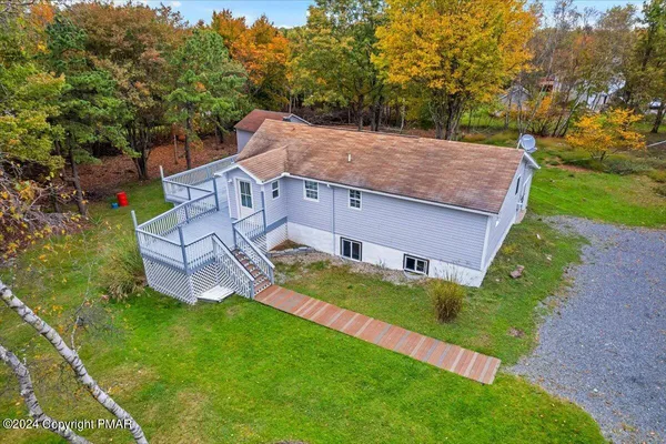 a view of a room with gym equipment and windows
