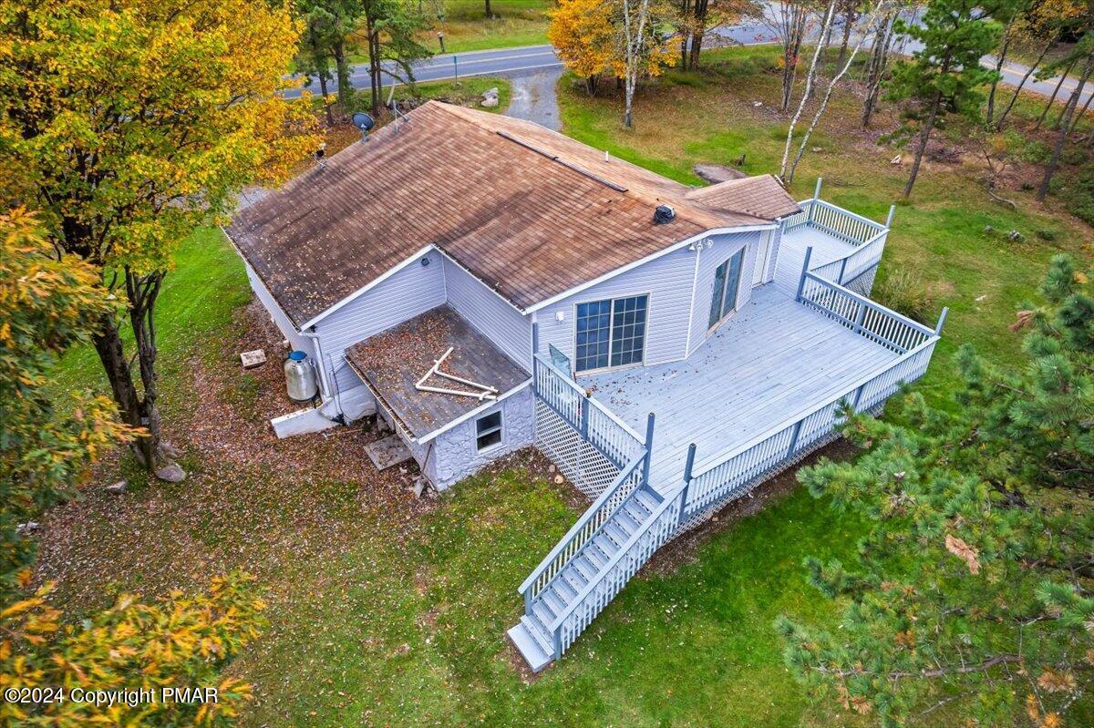 1456 Allegheny Drive Blakeslee, PA 18610 - Photo 4 of 94 an aerial view of a house with a yard table and chairs