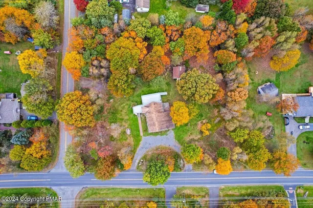 an empty room with wooden floor and closet