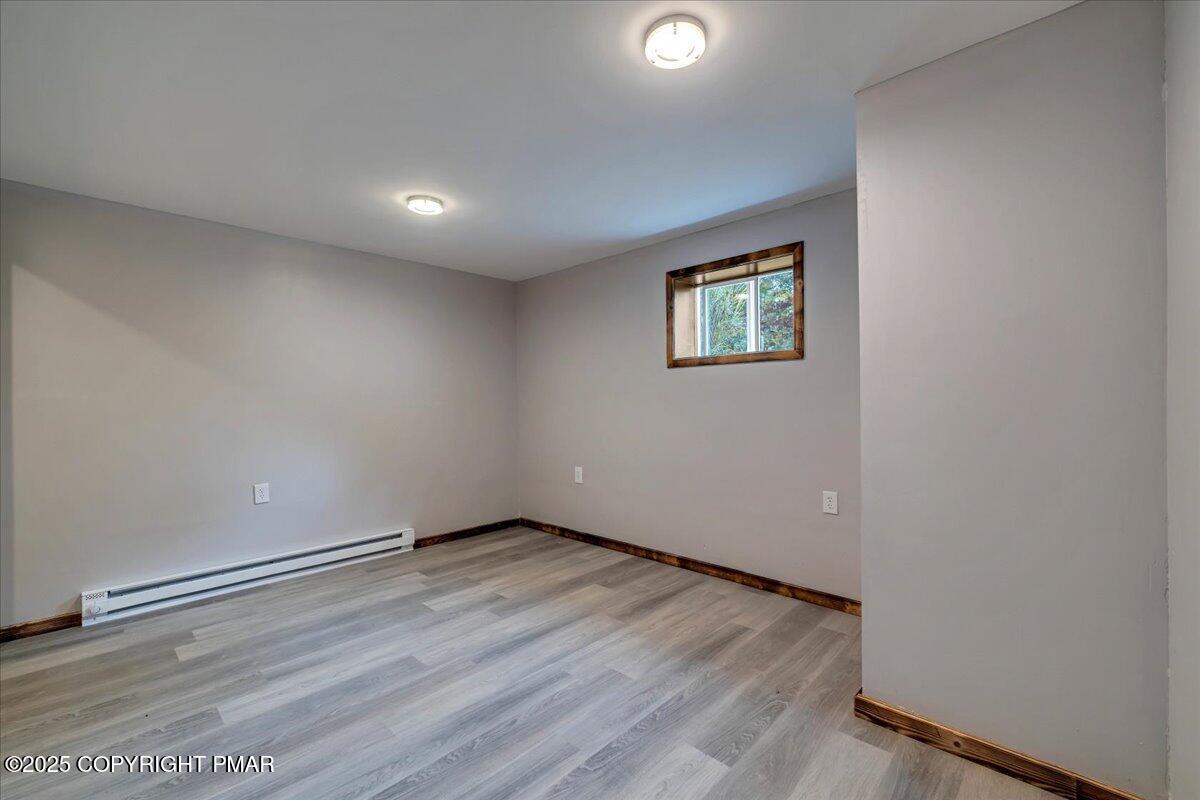 1456 Allegheny Drive Blakeslee, PA 18610 - Photo 88 of 94 an empty room with wooden floor and window