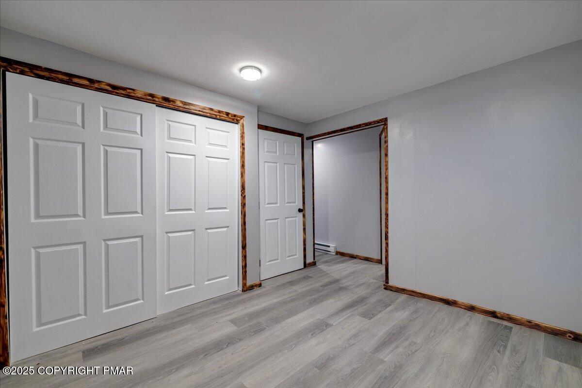 1456 Allegheny Drive Blakeslee, PA 18610 - Photo 93 of 94 an empty room with wooden floor