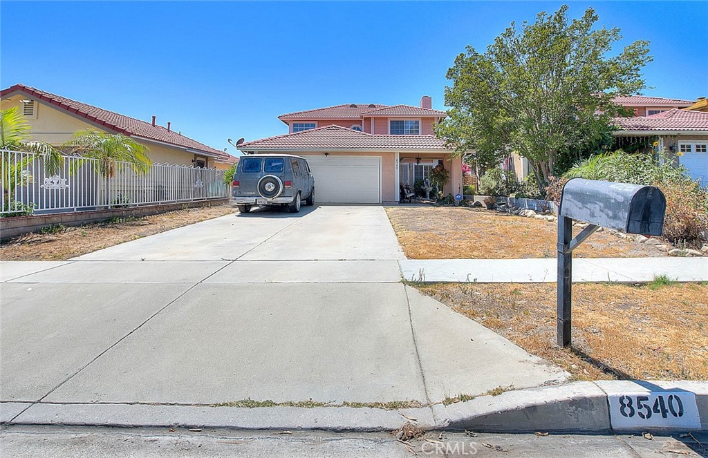 8540 Edwin Street Rancho Cucamonga, CA 91730 - Photo 1 of 1 a front view of a house with garden