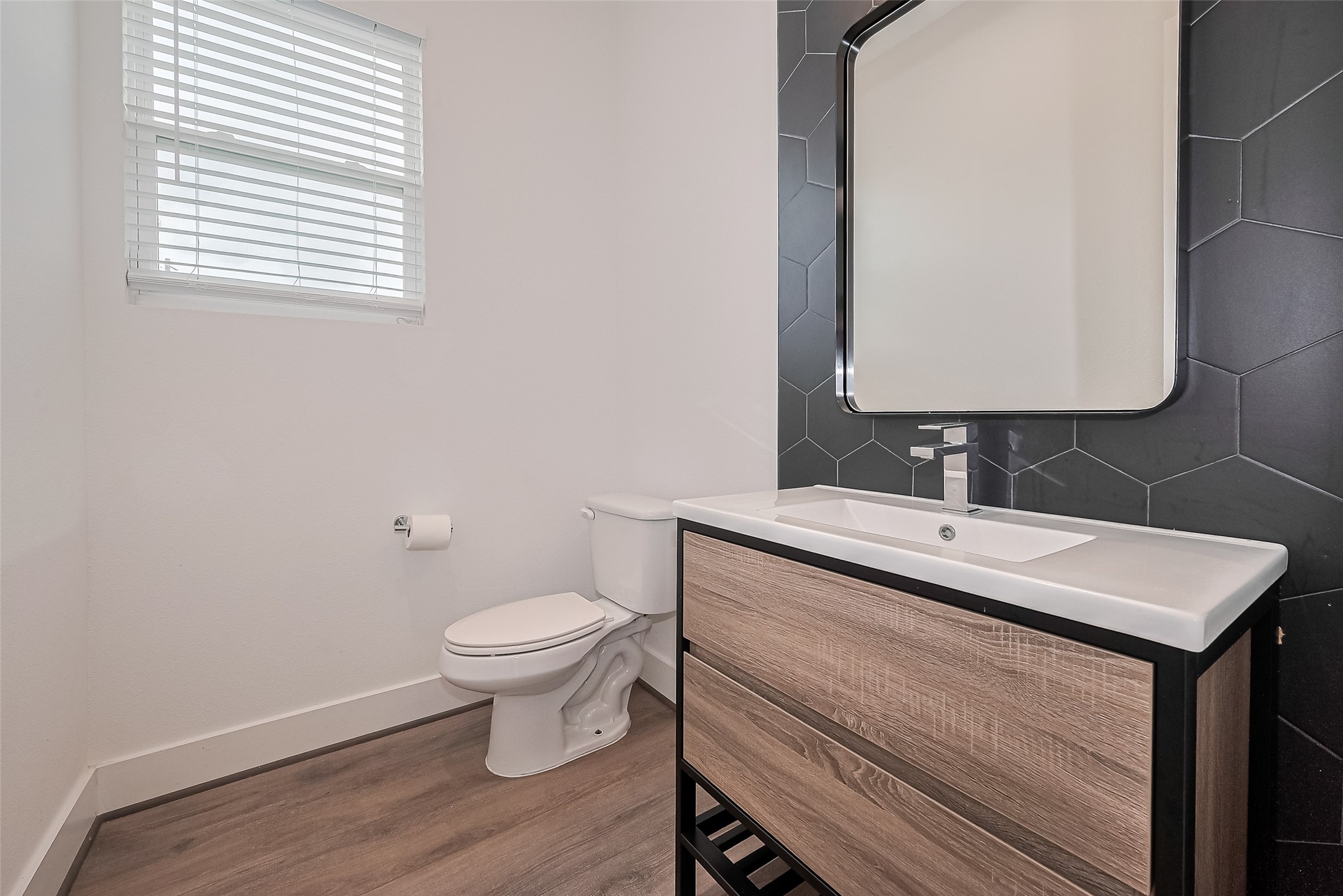 3510 Hadley Street Houston, TX 77004 - Photo 20 of 48 a bathroom with a sink toilet and a mirror