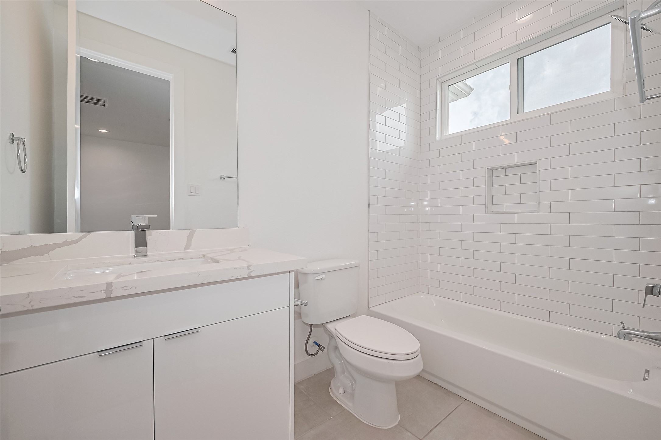 3510 Hadley Street Houston, TX 77004 - Photo 28 of 48 a bathroom with a granite countertop sink a toilet and bathtub