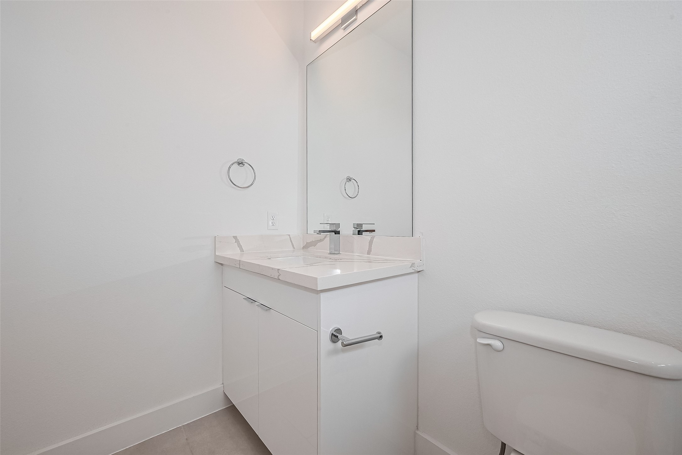 3510 Hadley Street Houston, TX 77004 - Photo 29 of 48 a bathroom with a sink a toilet and a mirror
