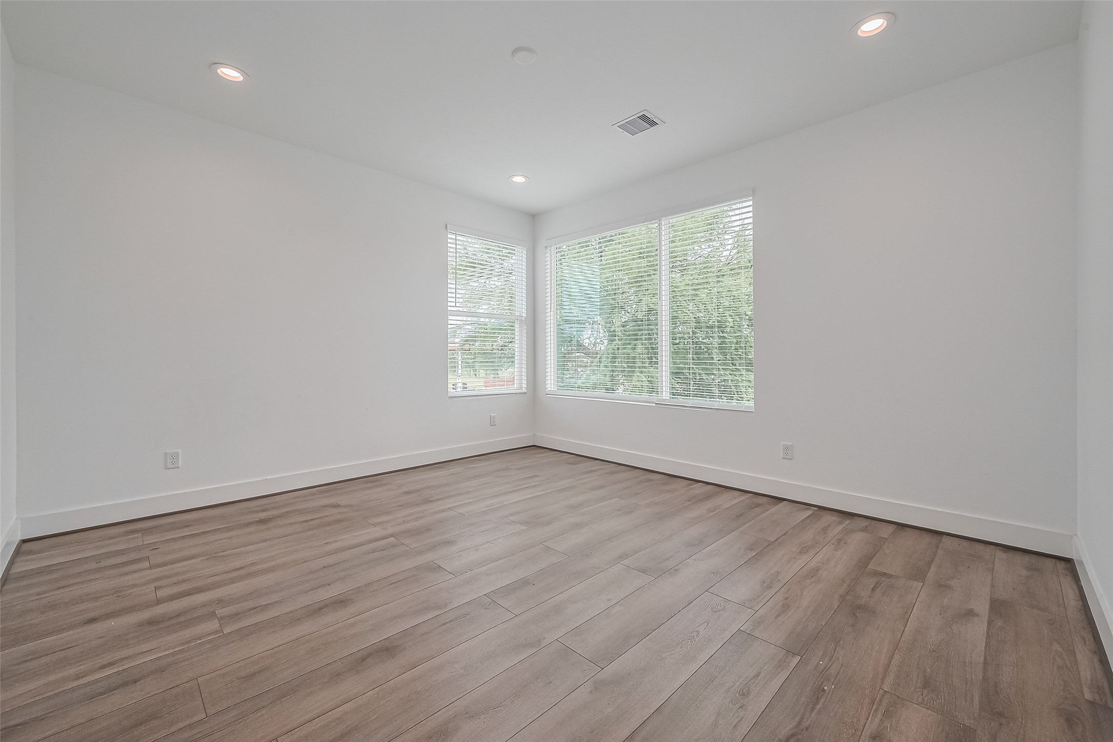 3510 Hadley Street Houston, TX 77004 - Photo 31 of 48 an empty room with wooden floor and windows