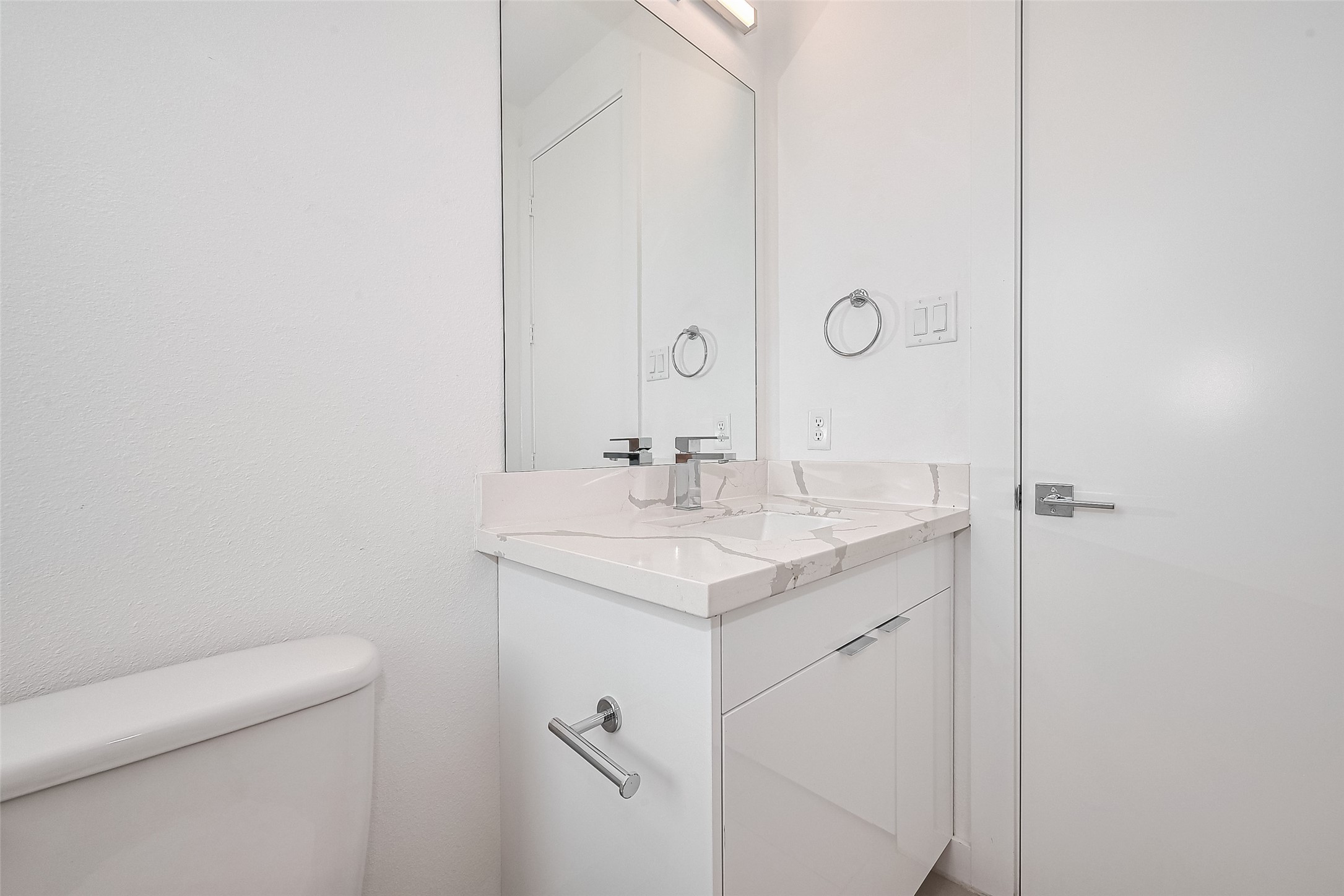 3510 Hadley Street Houston, TX 77004 - Photo 35 of 48 a bathroom with a sink a toilet and a mirror