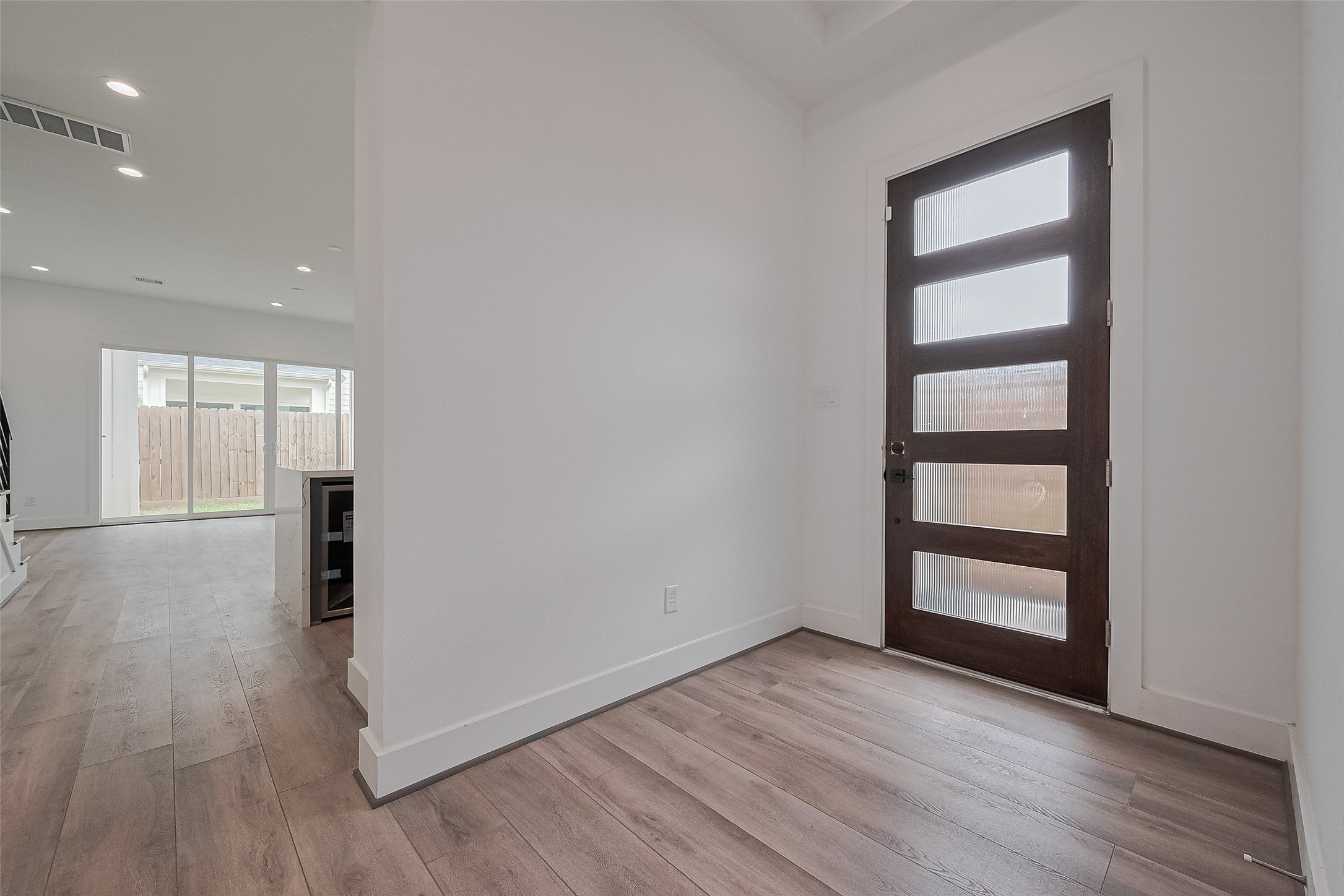 3510 Hadley Street Houston, TX 77004 - Photo 8 of 48 Step inside to a bright and welcoming foyer where natural light and clean sightlines guide you into the heart of the home. Just to the right, the open layout begins to unfold.