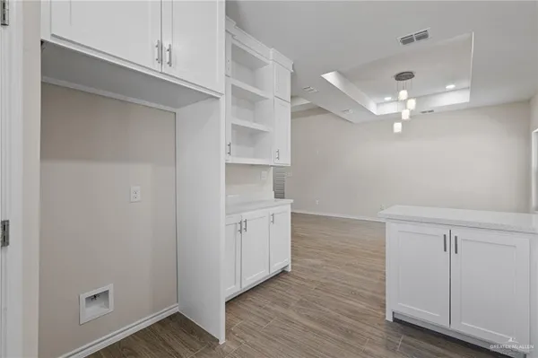 an empty room with a window and a ceiling fan