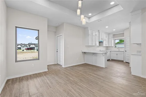 a view of a kitchen with marble kitchen and stainless steel appliances