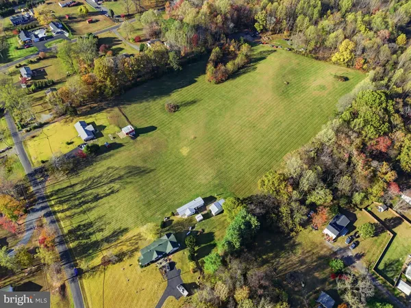a view of a lake with a yard