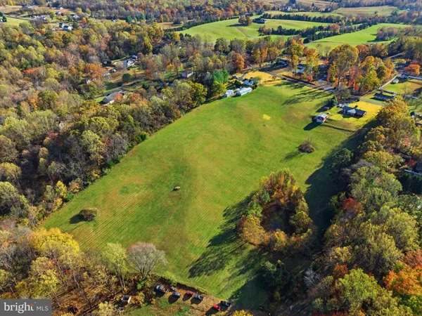 a view of a lake with a yard