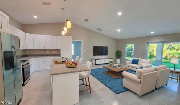 a living room with fireplace furniture and a flat screen tv