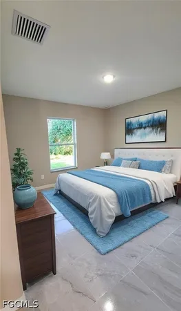 a bedroom with a bed and a couch