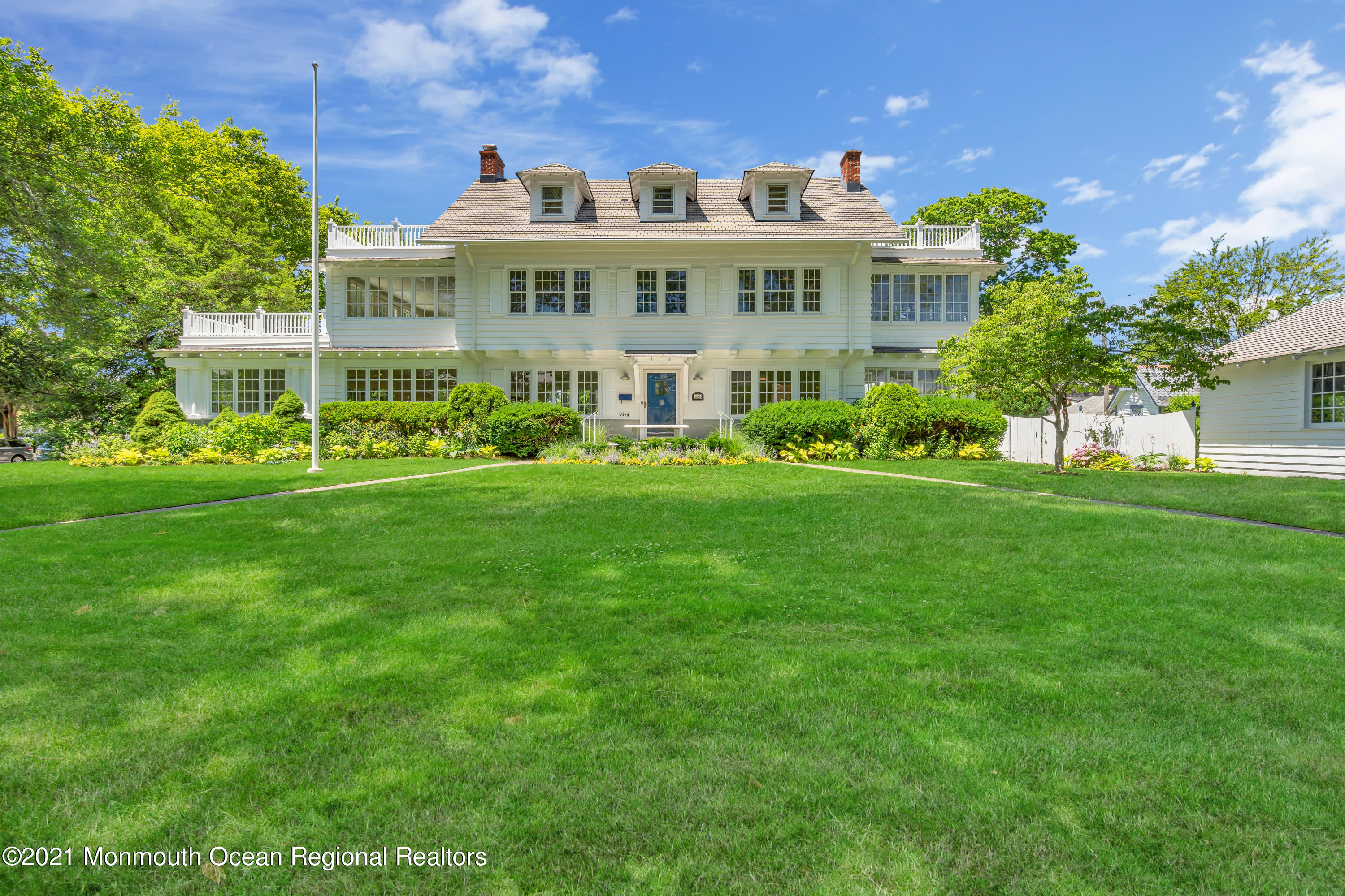 a view of a building with a yard