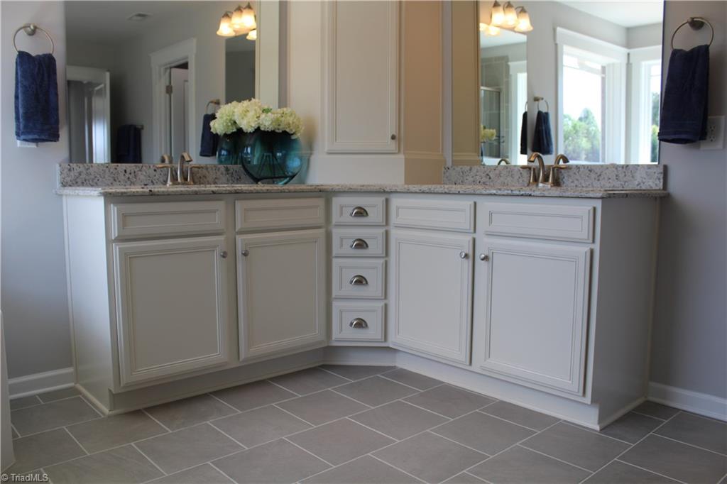 2629 Lunsford Road Summerfield, NC 27358 - Photo 14 of 28 Owner's luxury bathroom - upgraded tile and cabinets