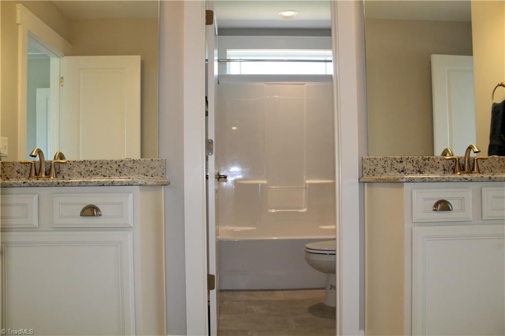 2629 Lunsford Road Summerfield, NC 27358 - Photo 19 of 28 Jack n Jill bathroom between bedrooms 2 & 3